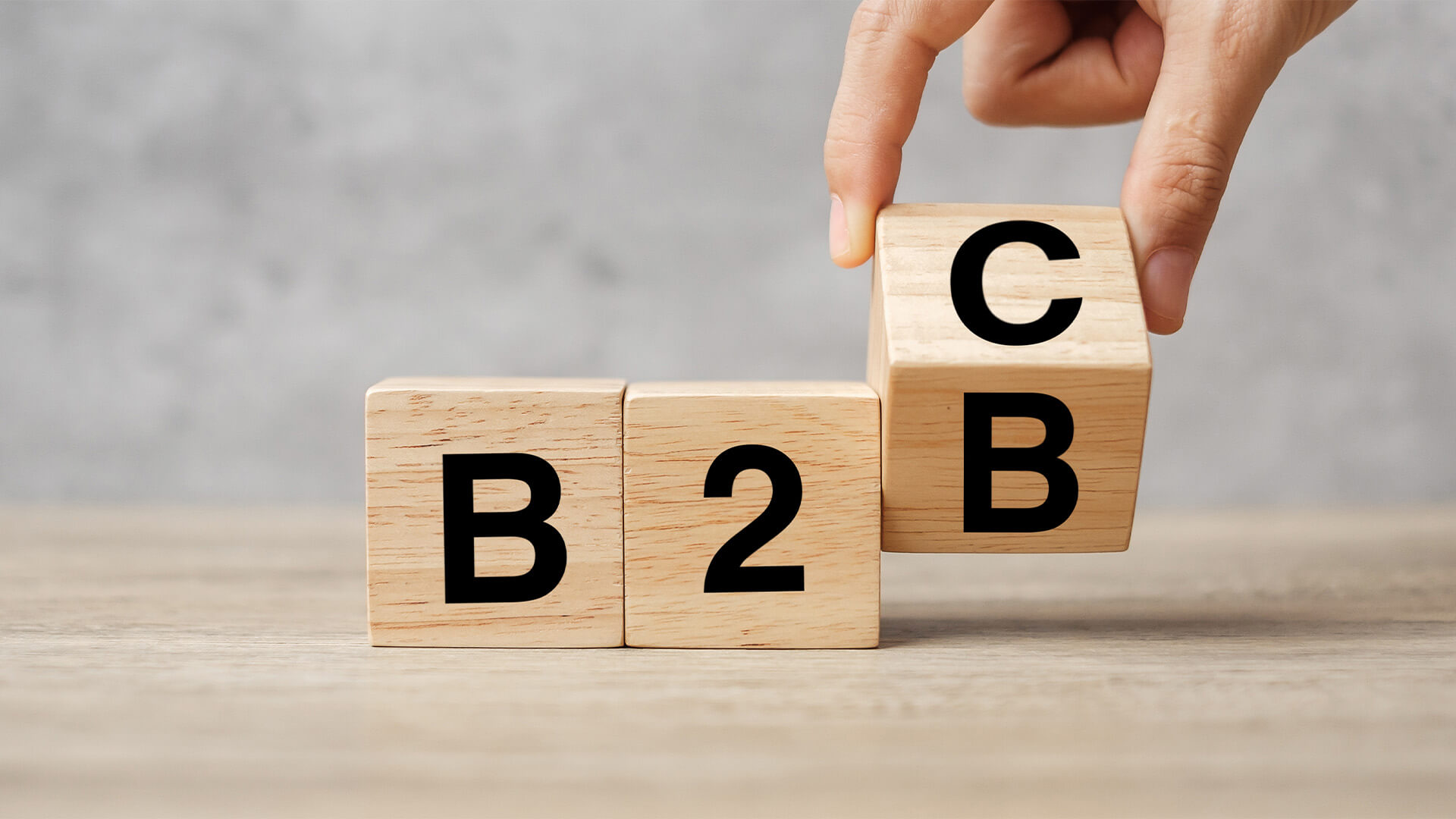 Wooden blocks with B2 on them and one being turned between B and C