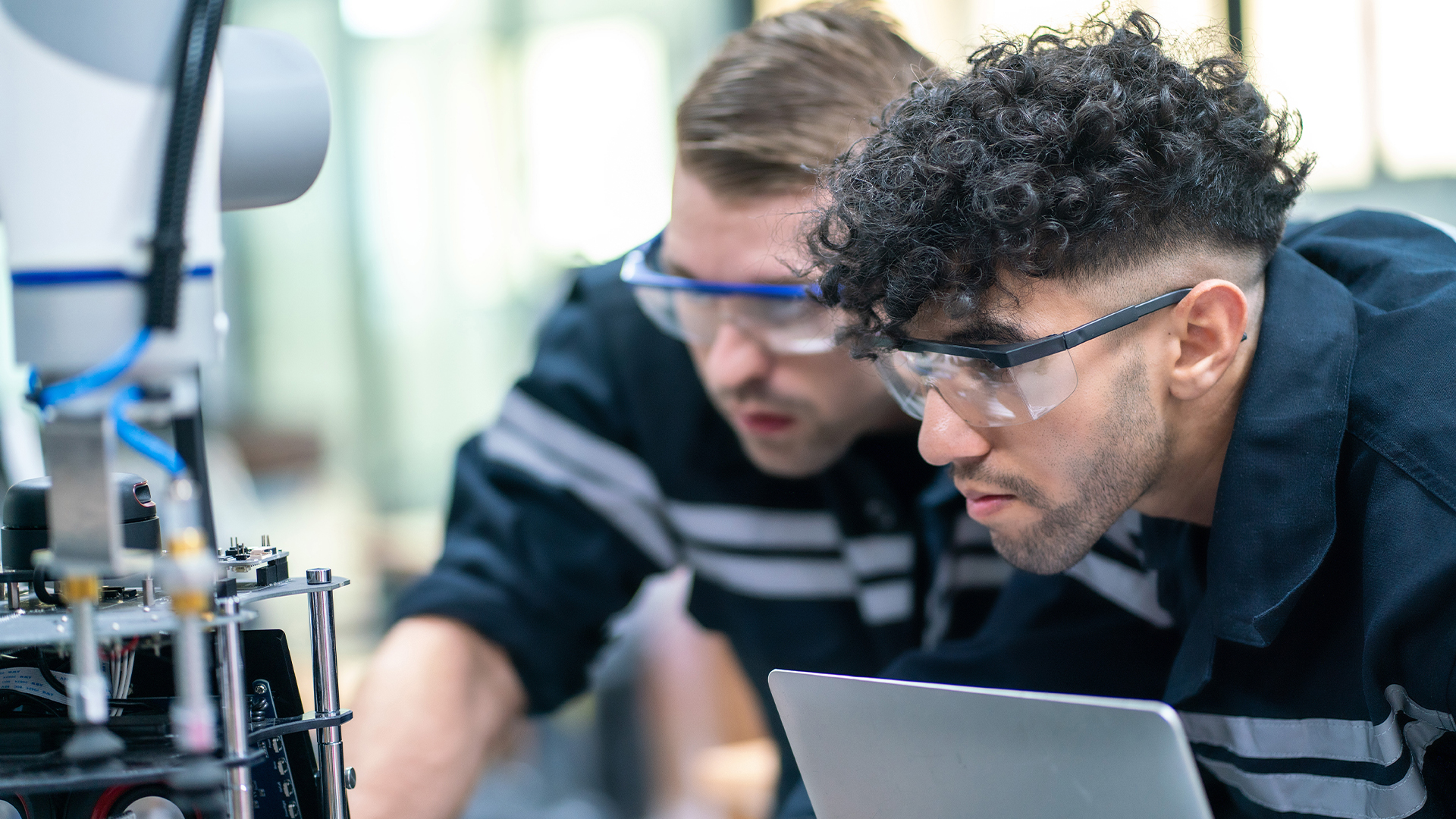 Mechanical engineering team working in robotic technology lap for research and develop for manufacturing automation and robotics