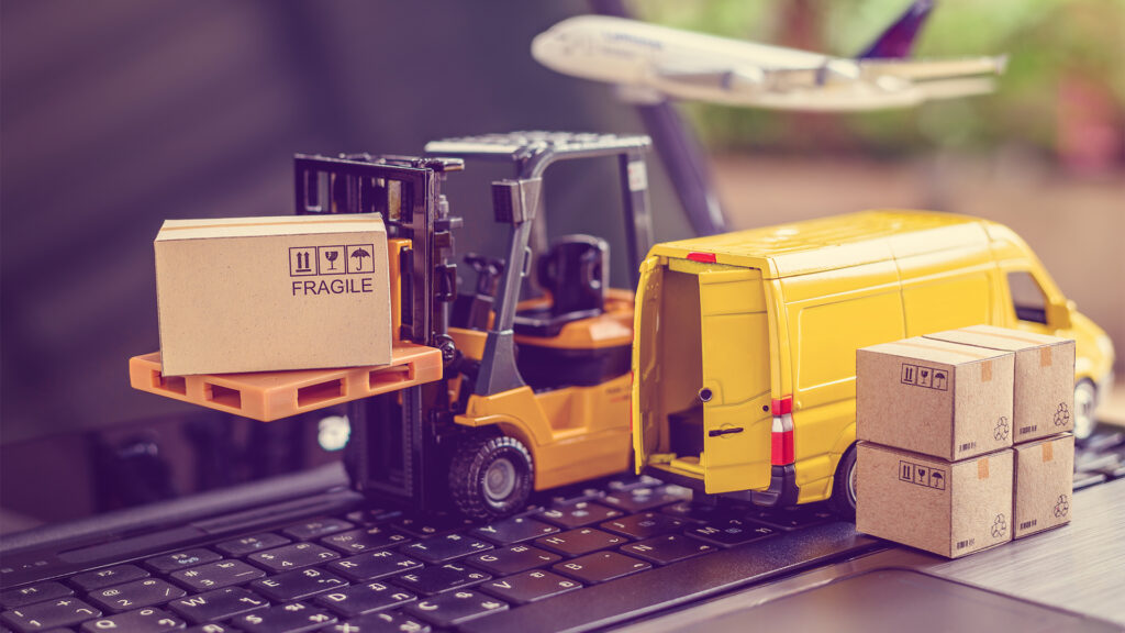 yellow small van and boxes on a keyboard