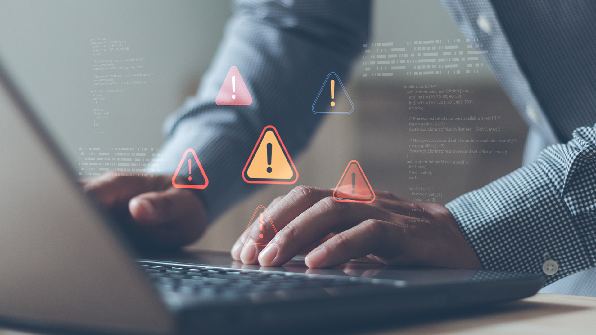 Businessman with cybersecurity system warning alert on laptop
